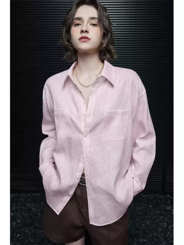 A woman in a pink linen long-sleeved shirt