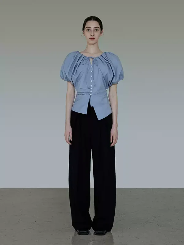 A woman in a French short-sleeved shirt