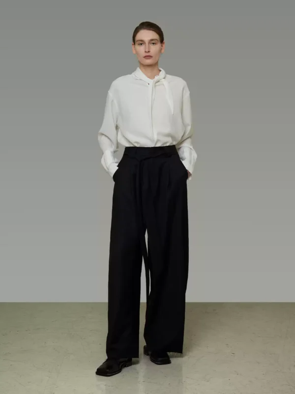 A white shirt with a tie around the collar
